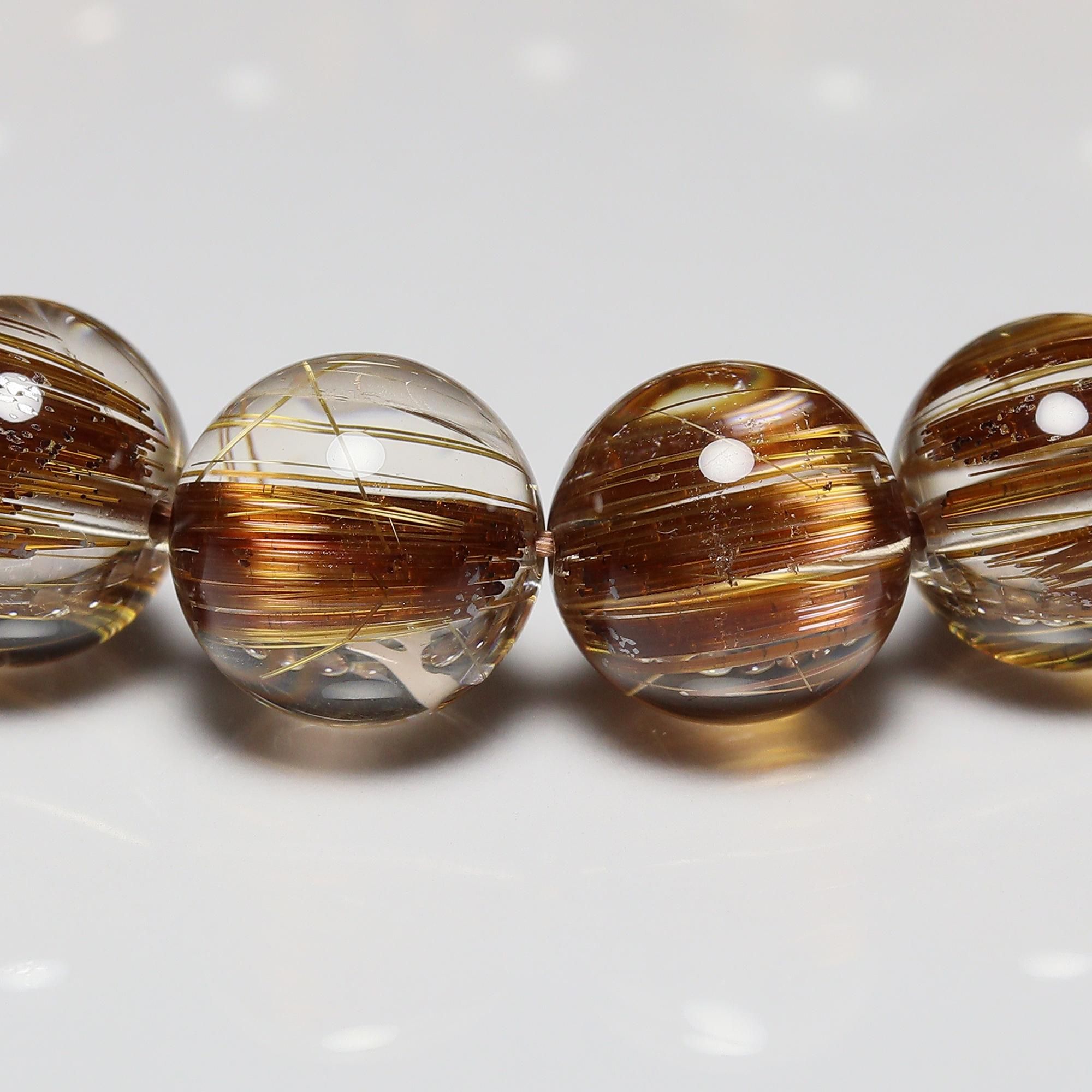 ブラウン ルチルクォーツ 高品質+/クリアタイプ】タイチンブラウンルチルクォーツ(キャッツアイ