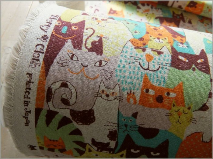 綿麻キャンバス 生地】ネコいっぱい猫ネコ*orange*1B - 生地通販 マーブルマーケット