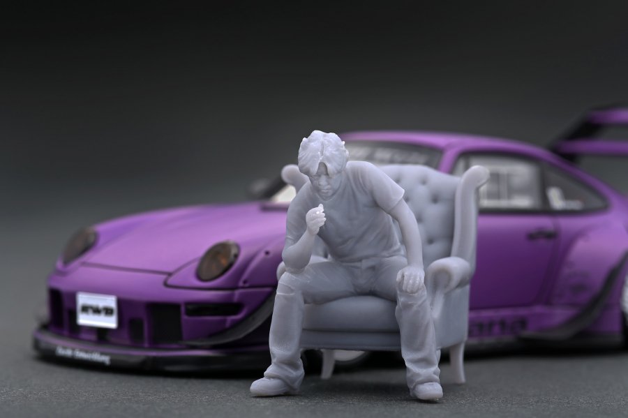 IG2322 1/43 RWB 993 Matte Purple With Mr. Nakai sitting on sofa